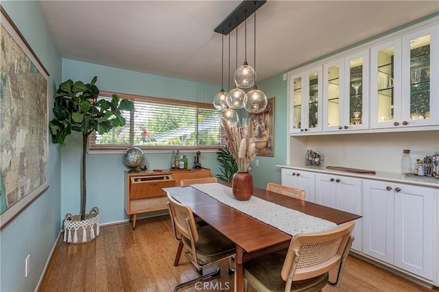 16733 Archwood St, Van Nuys, CA 91406 - dining room featuring light wood-style flooring and baseboards
