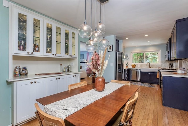 16733 Archwood St, Van Nuys, CA 91406 - dining room with light wood-type flooring and recessed lighting