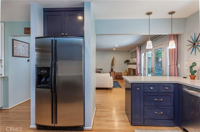 16733 Archwood St, Van Nuys, CA 91406 - kitchen with stainless steel appliances, light wood finished floors, light countertops, a peninsula, and recessed lighting