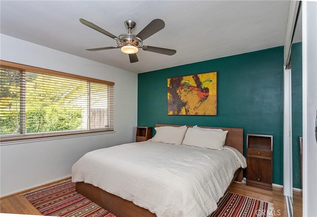 16733 Archwood St, Van Nuys, CA 91406 - bedroom with wood finished floors, baseboards, and a ceiling fan