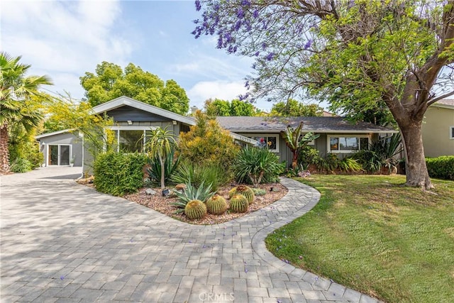 16733 Archwood St, Van Nuys, CA 91406 - view of front of property featuring a front yard, driveway, and a carport