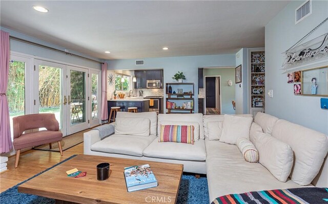 16733 Archwood St, Van Nuys, CA 91406 - living room featuring french doors and recessed lighting