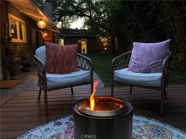 16733 Archwood St, Van Nuys, CA 91406 - wooden deck featuring an outdoor fire pit