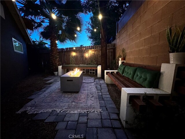 16733 Archwood St, Van Nuys, CA 91406 - fenced backyard with an outdoor fire pit and a patio