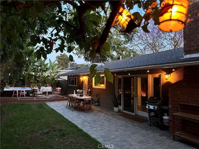 16733 Archwood St, Van Nuys, CA 91406 - back of house featuring a deck, roof with shingles, a lawn, a chimney, and a patio area