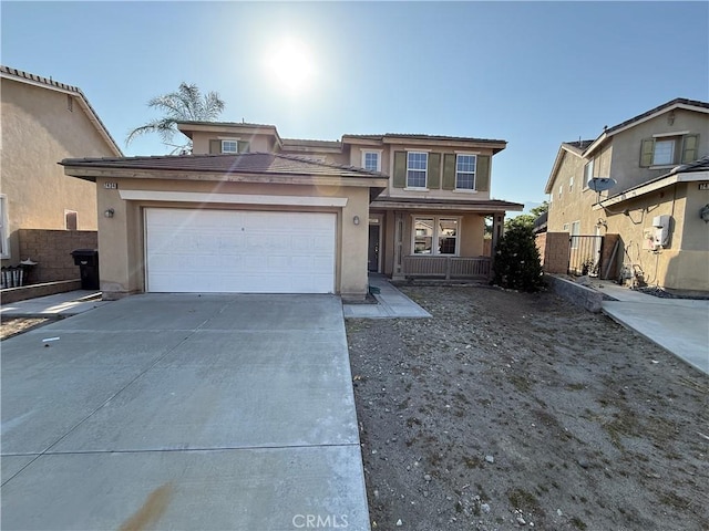 7434 Freeport Cir, Fontana, CA 92336 - traditional-style house with stucco siding, concrete driveway, a garage, and covered porch