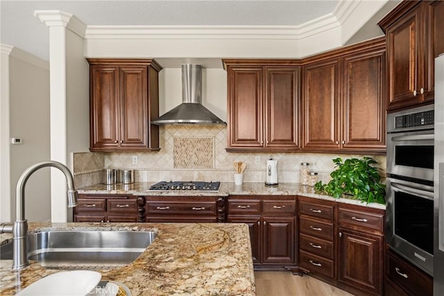 14 Celonova Pl, Lake Forest, CA 92610 - kitchen featuring wall chimney exhaust hood, appliances with stainless steel finishes, light stone countertops, and crown molding