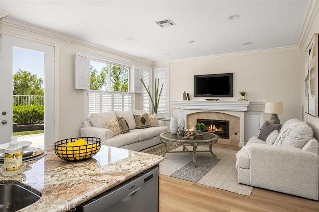 14 Celonova Pl, Lake Forest, CA 92610 - living room featuring light wood-style flooring, a premium fireplace, and crown molding