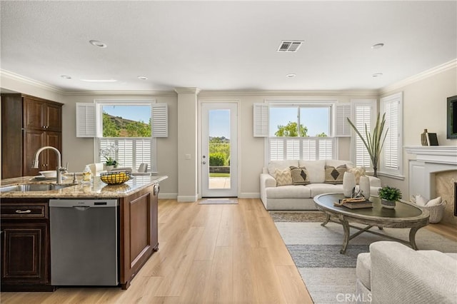 14 Celonova Pl, Lake Forest, CA 92610 - living room featuring ornamental molding, light wood-style flooring, and a fireplace