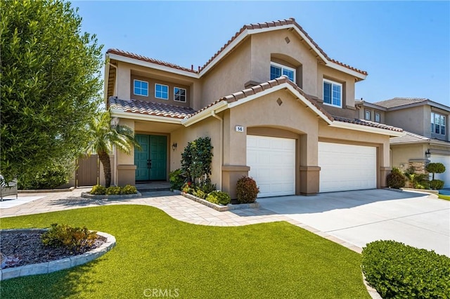 14 Celonova Pl, Lake Forest, CA 92610 - mediterranean / spanish house featuring stucco siding, a tiled roof, a garage, a front lawn, and driveway