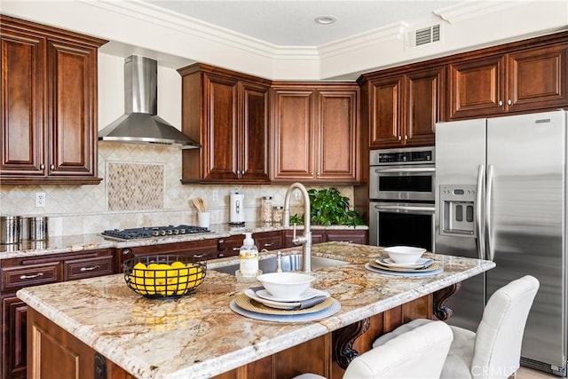 14 Celonova Pl, Lake Forest, CA 92610 - kitchen with appliances with stainless steel finishes, wall chimney range hood, light stone counters, a breakfast bar, and crown molding