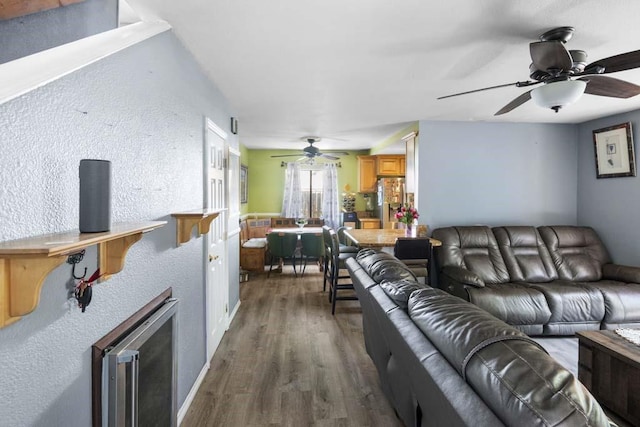 11073 Andrews St, South El Monte, CA 91733 - living area with ceiling fan, dark wood-type flooring, a textured wall, and wine cooler
