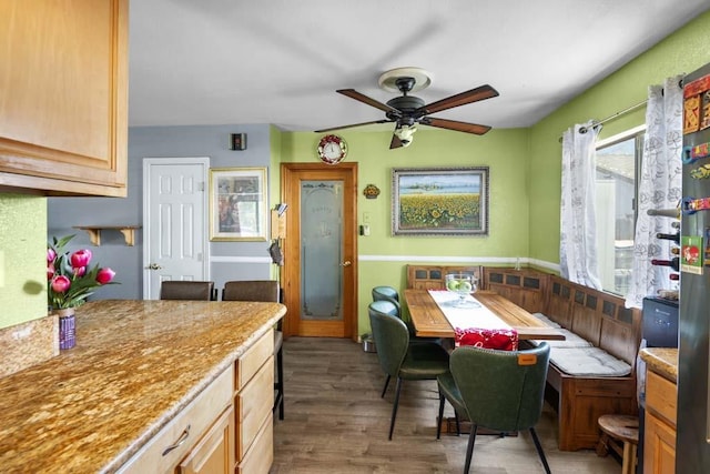 11073 Andrews St, South El Monte, CA 91733 - dining area featuring ceiling fan, wood finished floors, and wainscoting