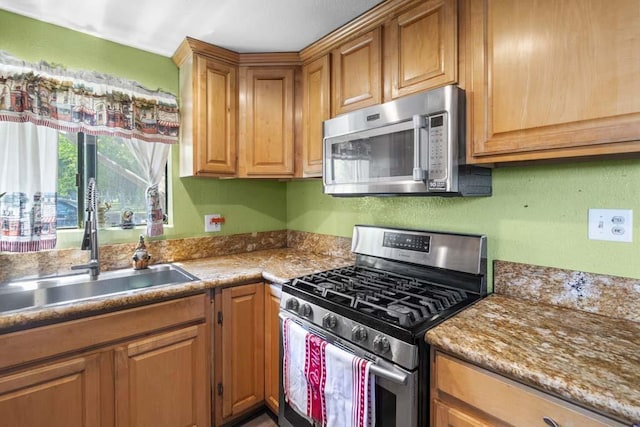 11073 Andrews St, South El Monte, CA 91733 - kitchen featuring stainless steel appliances and brown cabinetry