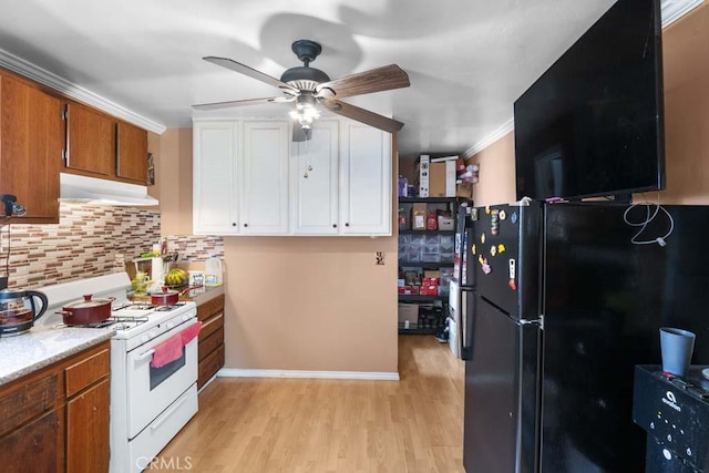 11073 Andrews St, South El Monte, CA 91733 - kitchen with white gas range, freestanding refrigerator, under cabinet range hood, ceiling fan, and decorative backsplash