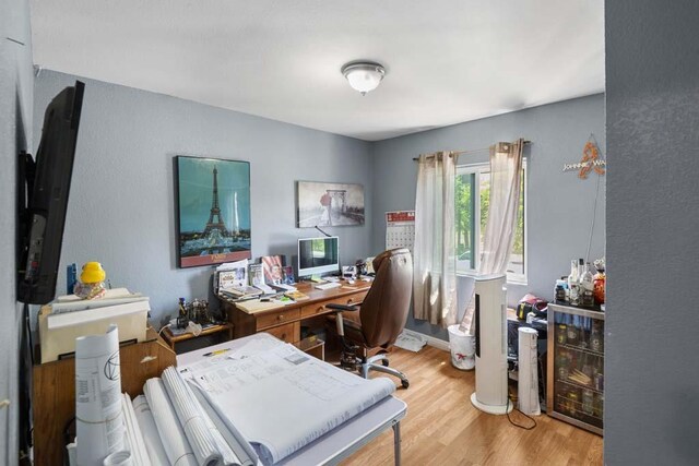 11073 Andrews St, South El Monte, CA 91733 - home office featuring wood finished floors and a textured wall