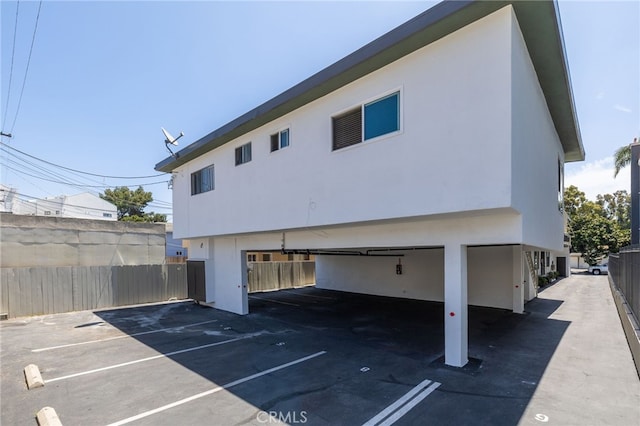 3337 S Durango Ave, Los Angeles, CA 90034 - rear view of property with stucco siding and a parking lot