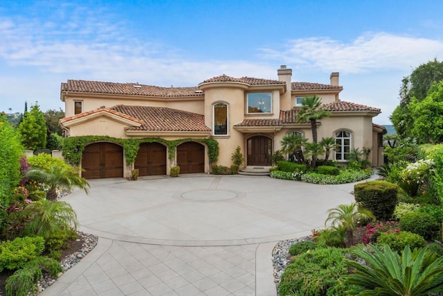 5106 Meadows Del Mar, San Diego, CA 92130 - mediterranean / spanish house with a chimney, curved driveway, stucco siding, an attached garage, and a tile roof