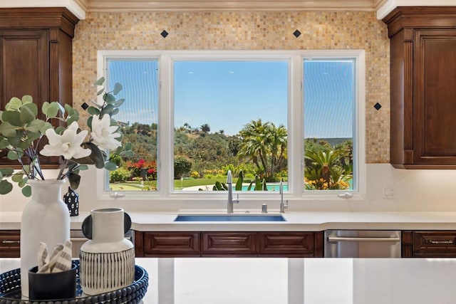 5106 Meadows Del Mar, San Diego, CA 92130 - kitchen featuring a sink, stainless steel dishwasher, light countertops, and crown molding