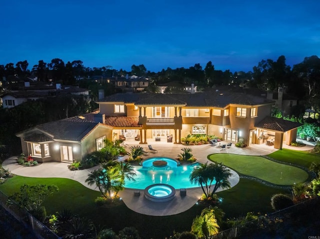 5106 Meadows Del Mar, San Diego, CA 92130 - back of house featuring a putting green, a pool with connected hot tub, a balcony, and a patio