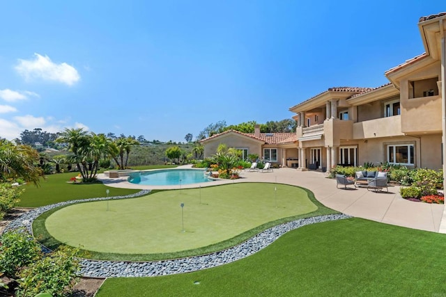 5106 Meadows Del Mar, San Diego, CA 92130 - swimming pool featuring a putting area, a patio, an outdoor hangout area, and a lawn