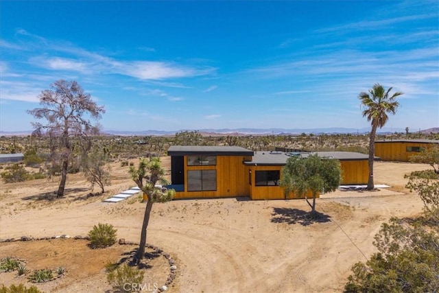 3977 Sage Ave, Yucca Valley, CA 92284 - view of front of house with a mountain view, a desert view, and driveway