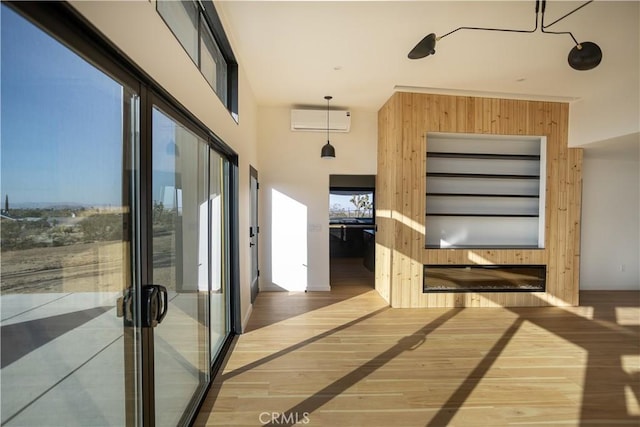 3977 Sage Ave, Yucca Valley, CA 92284 - corridor featuring wood finished floors and a wall mounted AC