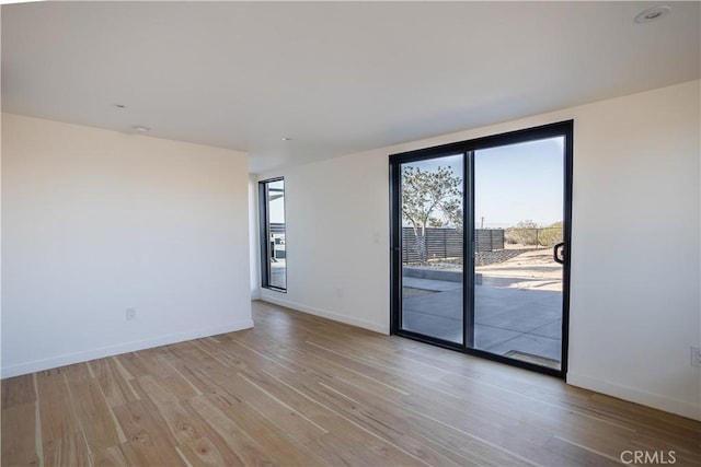 3977 Sage Ave, Yucca Valley, CA 92284 - spare room featuring light wood-style floors and baseboards