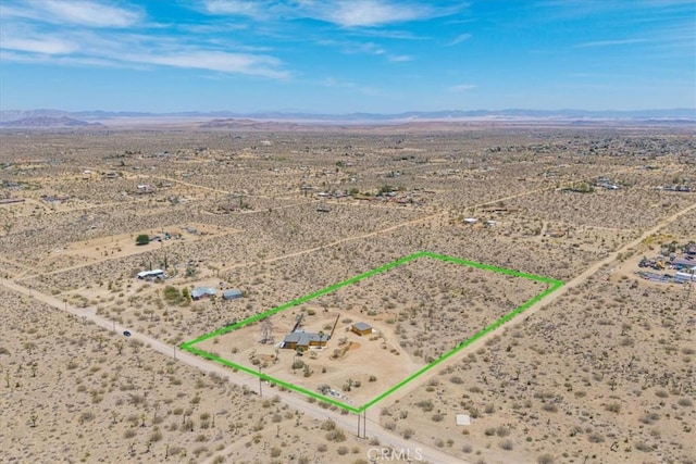 3977 Sage Ave, Yucca Valley, CA 92284 - aerial view of sparsely populated area with a desert landscape, a mountain backdrop, and property boundaries highlighted