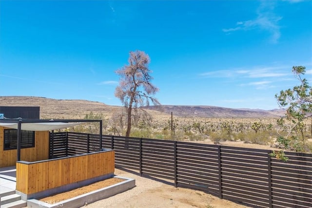 3977 Sage Ave, Yucca Valley, CA 92284 - view of patio / terrace with a mountain view and an exterior structure