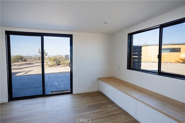 3977 Sage Ave, Yucca Valley, CA 92284 - interior space with light wood-style floors and baseboards