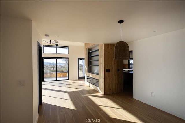 3977 Sage Ave, Yucca Valley, CA 92284 - unfurnished dining area with baseboards and wood finished floors