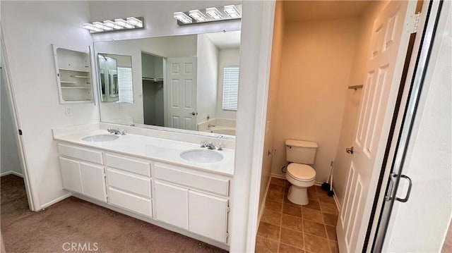 762 Saint James Dr, Corona, CA 92882 - bathroom with double vanity, baseboards, and toilet