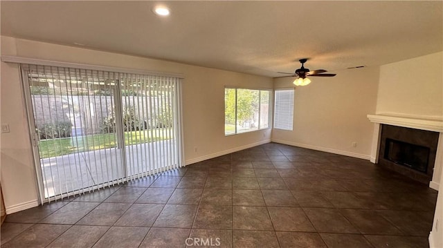 762 Saint James Dr, Corona, CA 92882 - unfurnished living room with ceiling fan, a large fireplace, dark tile patterned flooring, baseboards, and recessed lighting