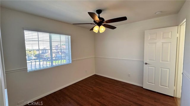 762 Saint James Dr, Corona, CA 92882 - spare room featuring dark wood finished floors, a ceiling fan, baseboards, and a smoke detector