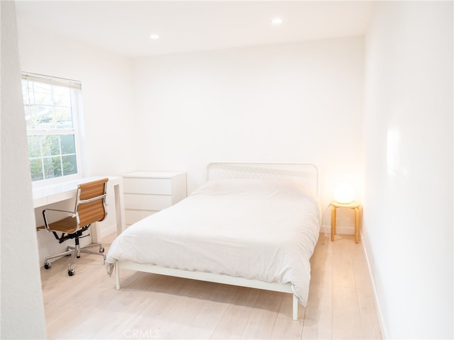 12907 Sunburst St, Los Angeles, CA 91331 - bedroom with a desk, wood finished floors, recessed lighting, and baseboards
