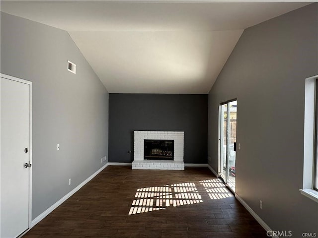 3030 Twincreek Ave, Palmdale, CA 93551 - unfurnished living room featuring lofted ceiling, wood finished floors, a fireplace, and baseboards