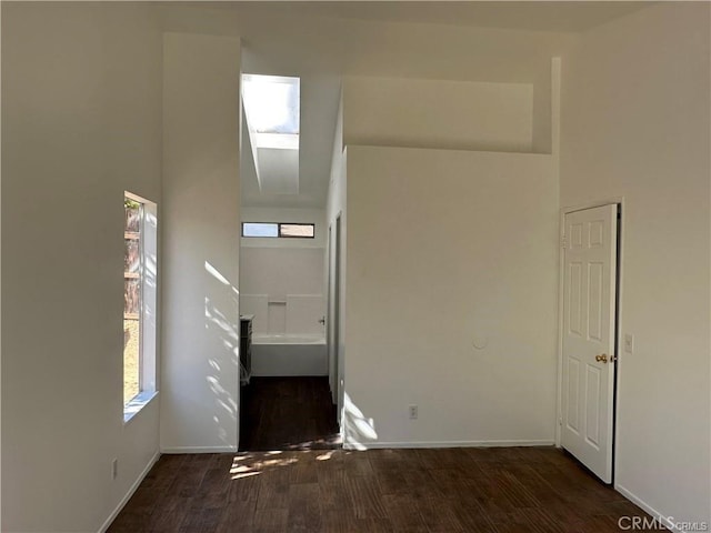 3030 Twincreek Ave, Palmdale, CA 93551 - spare room featuring wood finished floors, baseboards, and a skylight