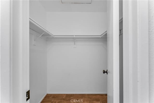 3030 Twincreek Ave, Palmdale, CA 93551 - walk in closet with dark wood-type flooring