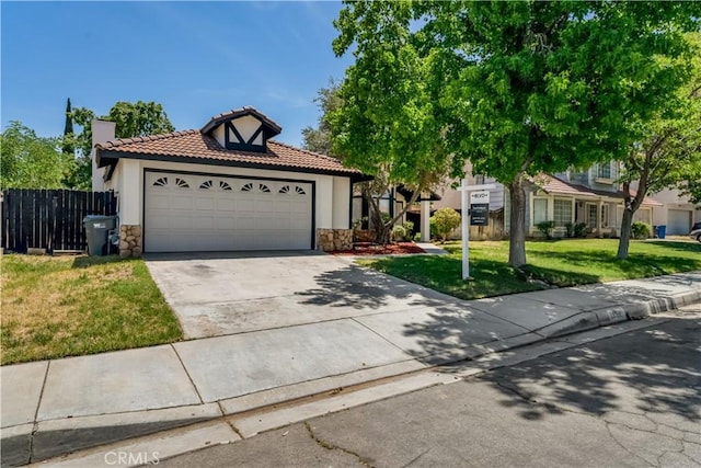 3030 Twincreek Ave, Palmdale, CA 93551 - view of front of house featuring stone siding, a tiled roof, concrete driveway, and stucco siding