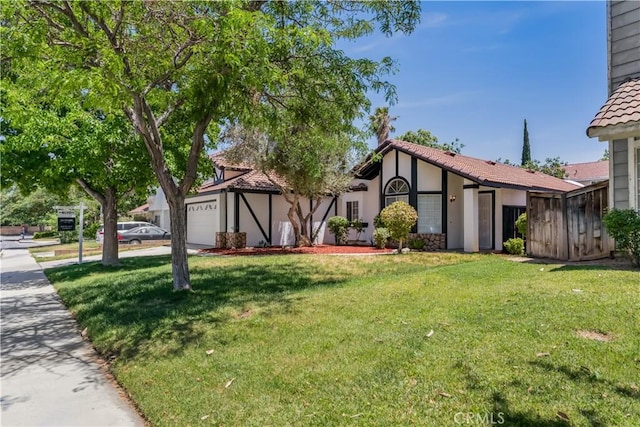 3030 Twincreek Ave, Palmdale, CA 93551 - view of front facade with a garage, stucco siding, a front lawn, and a tiled roof