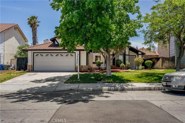 3030 Twincreek Ave, Palmdale, CA 93551 - view of front of home featuring stone siding, a garage, concrete driveway, and stucco siding