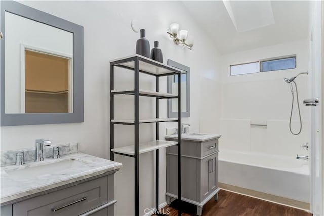 3030 Twincreek Ave, Palmdale, CA 93551 - bathroom with wood finished floors, two vanities, and shower / bathtub combination