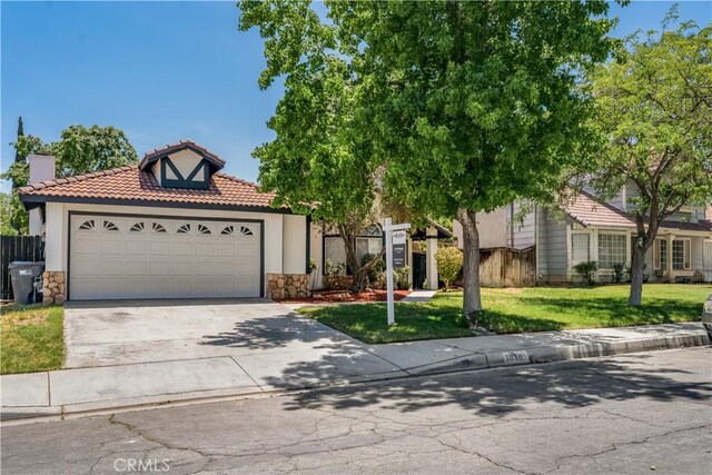 3030 Twincreek Ave, Palmdale, CA 93551 - view of front of property featuring stone siding, a tile roof, concrete driveway, a garage, and stucco siding