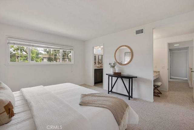 17442 Parker Dr, Tustin, CA 92780 - bedroom featuring light carpet, baseboards, and connected bathroom
