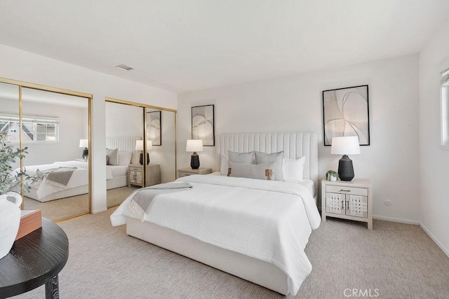 17442 Parker Dr, Tustin, CA 92780 - carpeted bedroom featuring multiple closets and baseboards