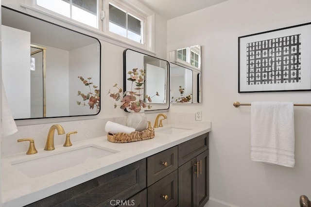 17442 Parker Dr, Tustin, CA 92780 - full bathroom with double vanity and baseboards