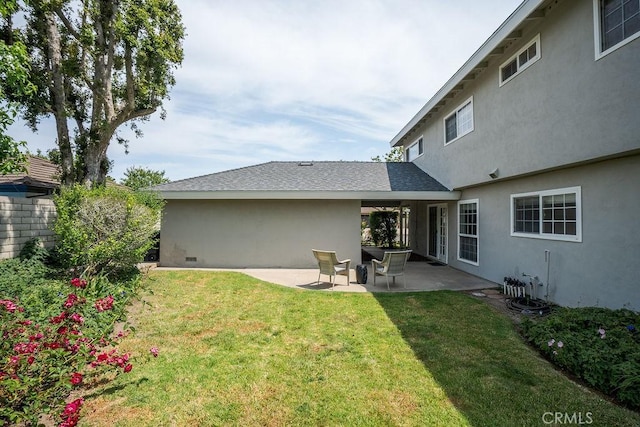 17442 Parker Dr, Tustin, CA 92780 - back of house with stucco siding, a patio area, and a yard