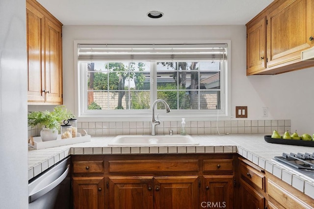17442 Parker Dr, Tustin, CA 92780 - kitchen featuring a sink, dishwasher, healthy amount of natural light, and tile countertops