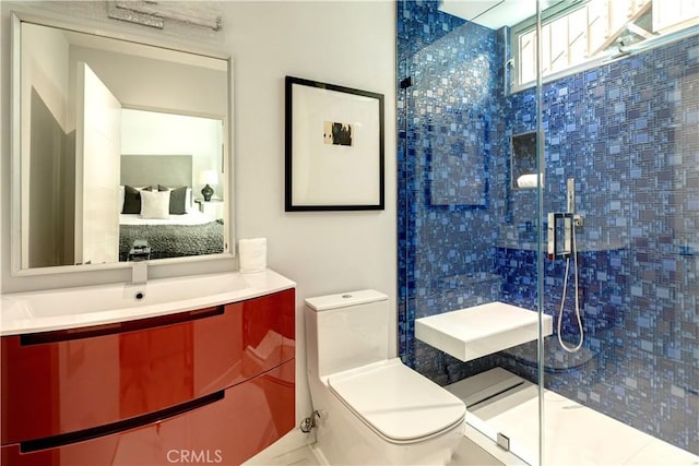 2522 The Strand, Manhattan Beach, CA 90266 - bathroom featuring toilet, a shower stall, and vanity